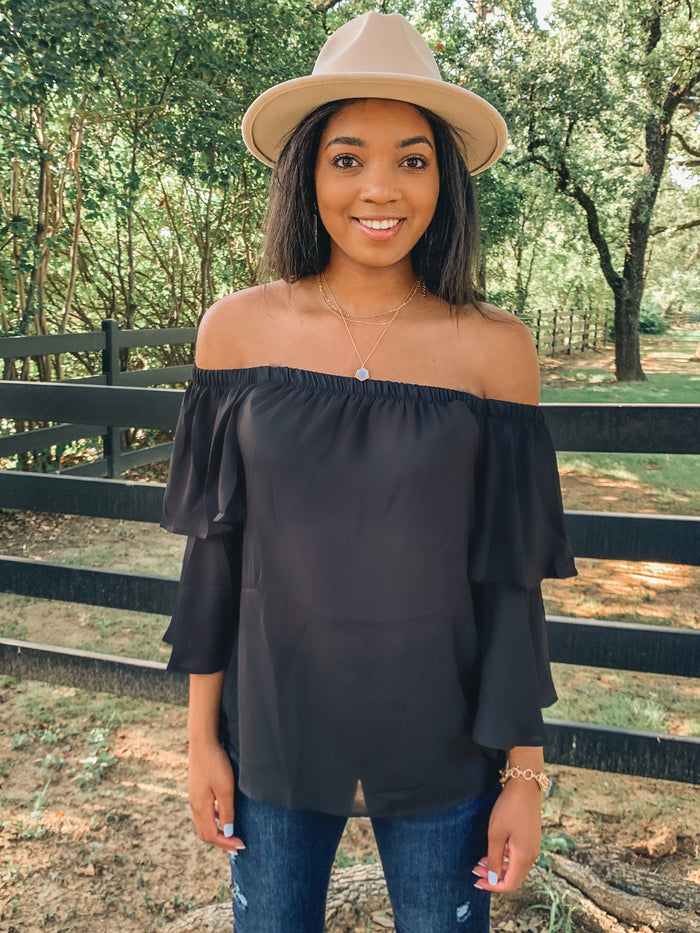 Black off shoulder ruffle blouse