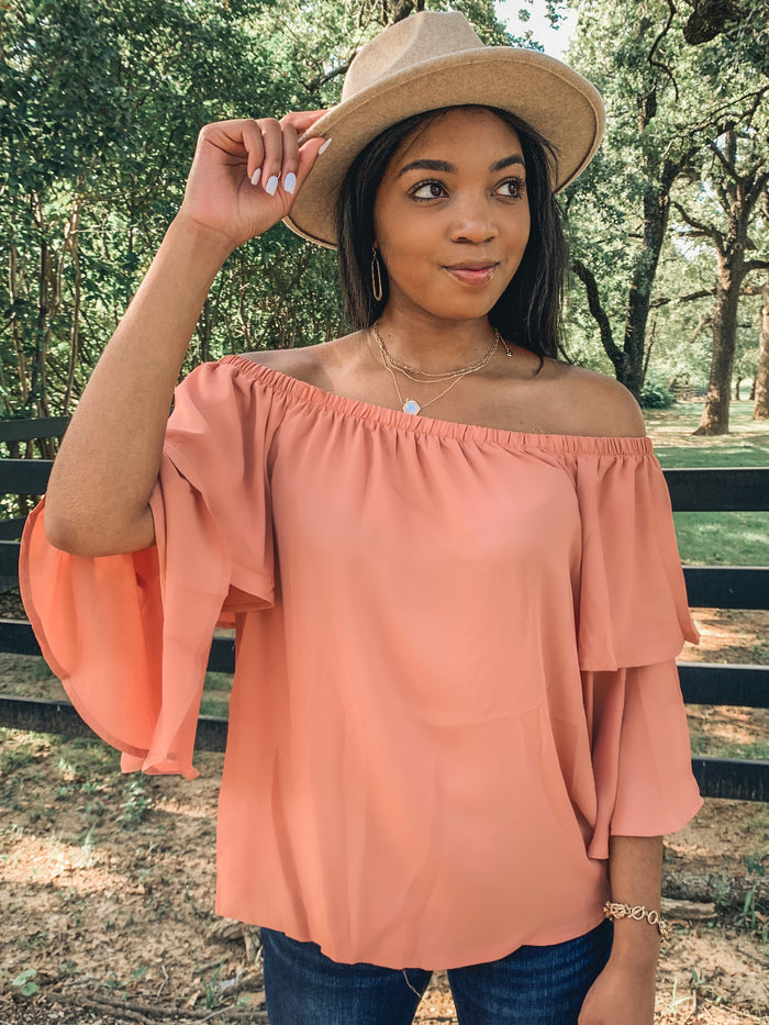 Orange off shoulder ruffle blouse