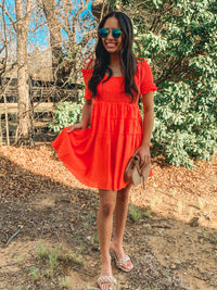 Orange smocked detail tiered mini dress