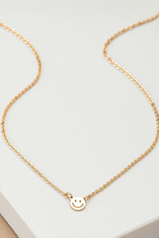 mini smiley face on a delicate chain necklace