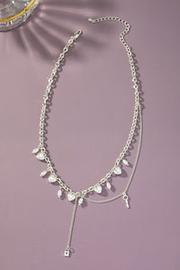 Asymmetric necklace with puffy heart drops