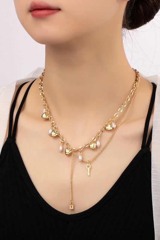 Asymmetric necklace with puffy heart drops