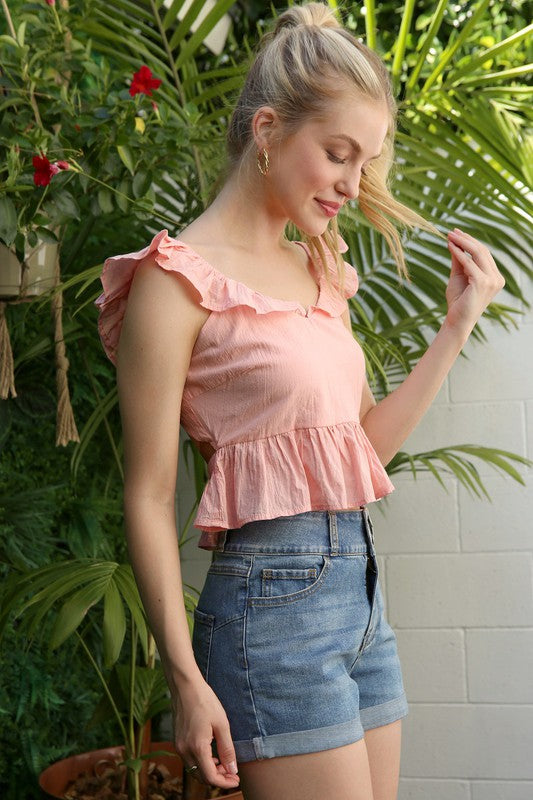 Pink ruffled top with flare