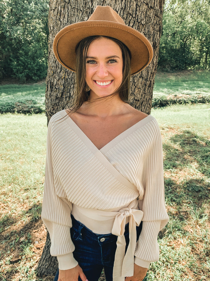 It’s back! Best seller! Ivory Tie Front Long Sleeve Wrap Sweater